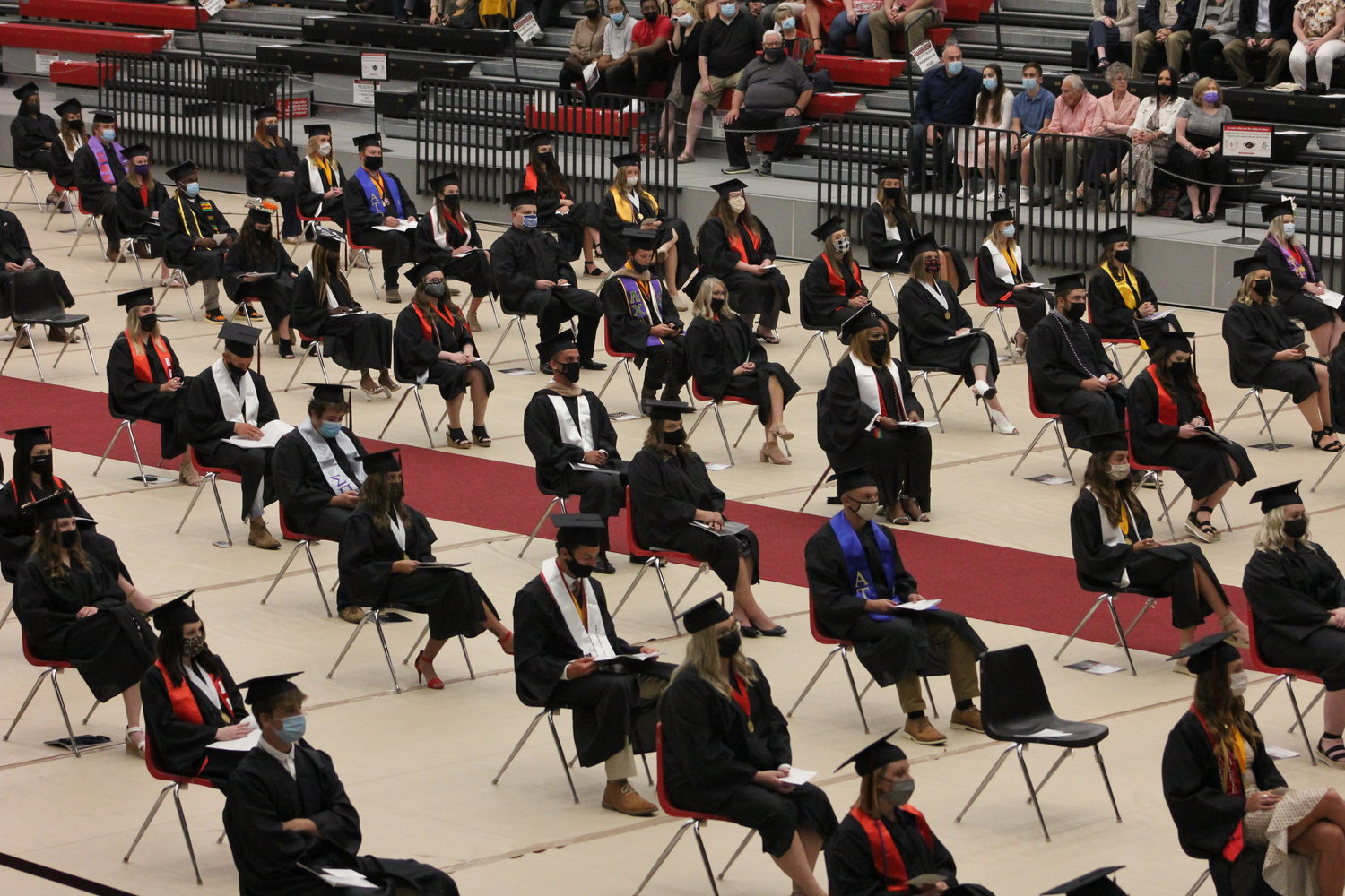 Graduate candidates sit socially distanced Friday, May 7, in the Multipurpose Building for the first of 10 spring 2021 commencement ceremonies at the University of Central Missouri.